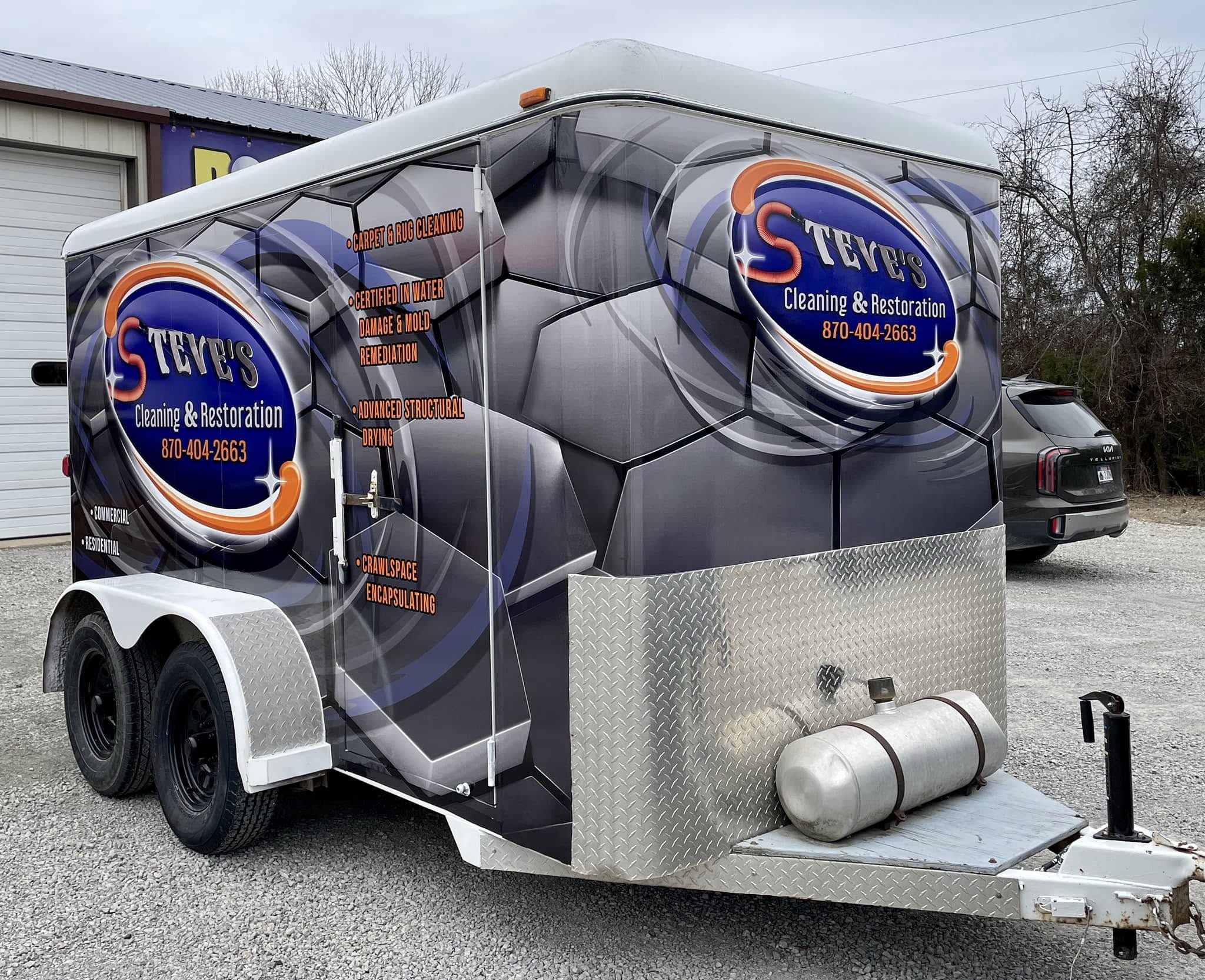 Full trailer wrap for Steve's Cleaning & Restoration featuring custom logo, services, and contact info.