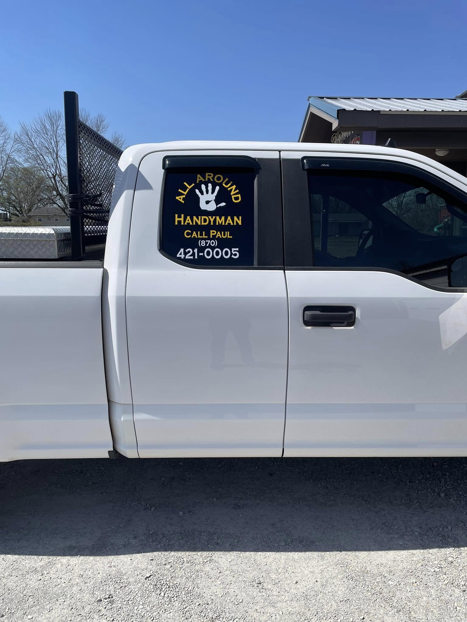 Custom yellow vinyl graphics on a white pickup truck for All Around Handyman service
