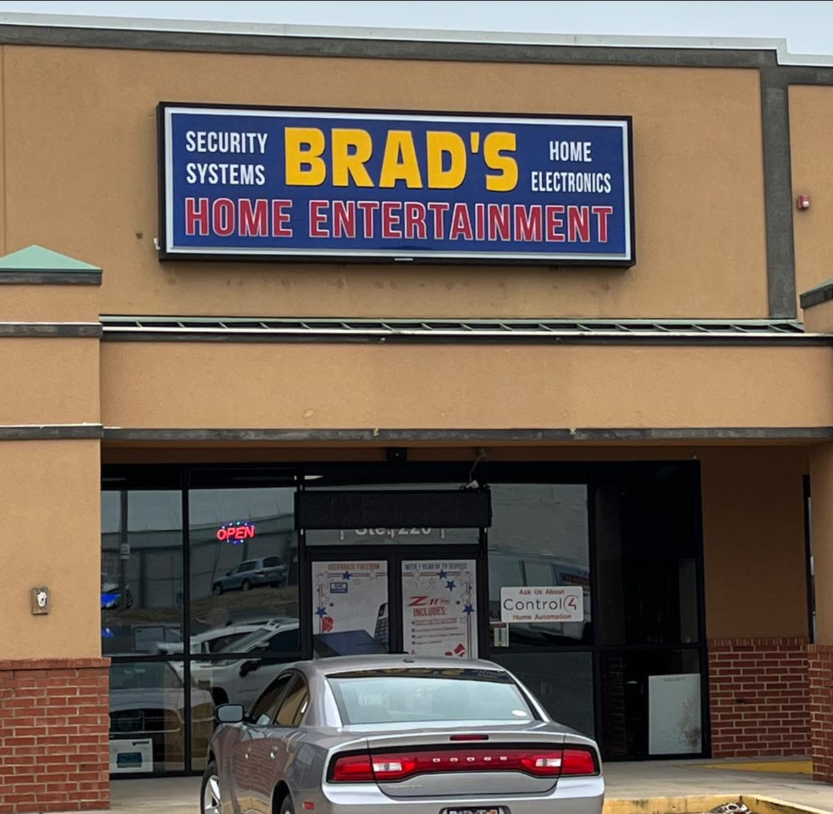 Illuminated cabinet sign for Brad's Home Entertainment, Security Systems, and Home Electronics.