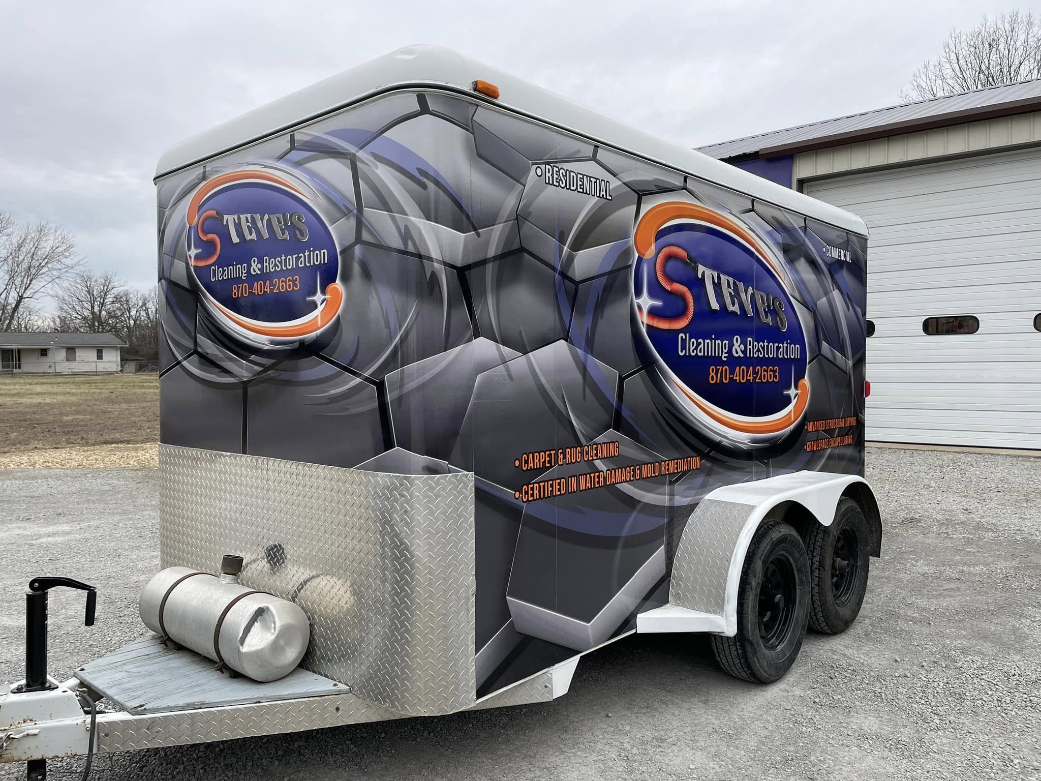 Full custom vinyl wrap on a cleaning and restoration company's enclosed utility trailer.