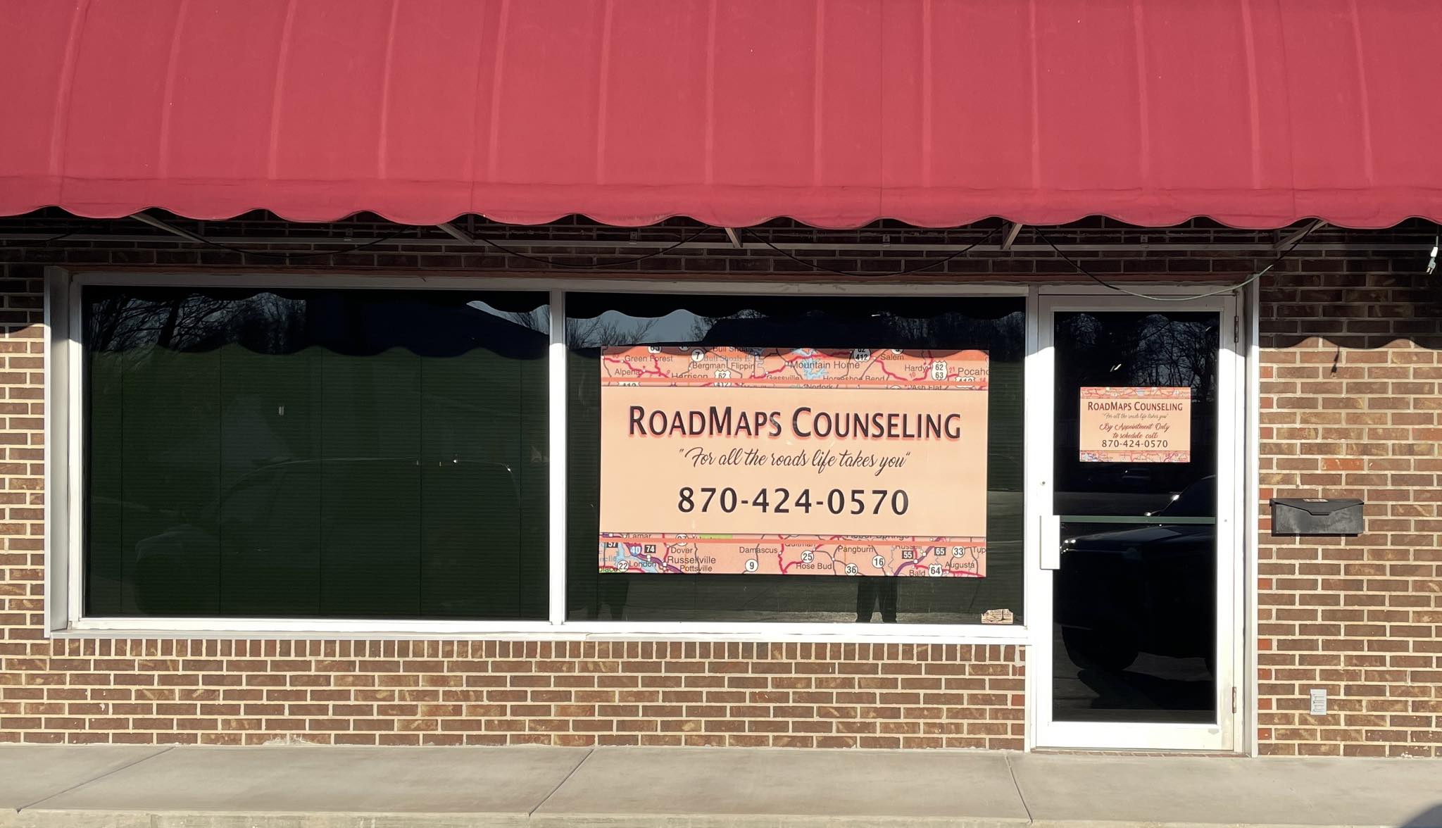 Window graphic for Roadmaps Counseling with map background and company information