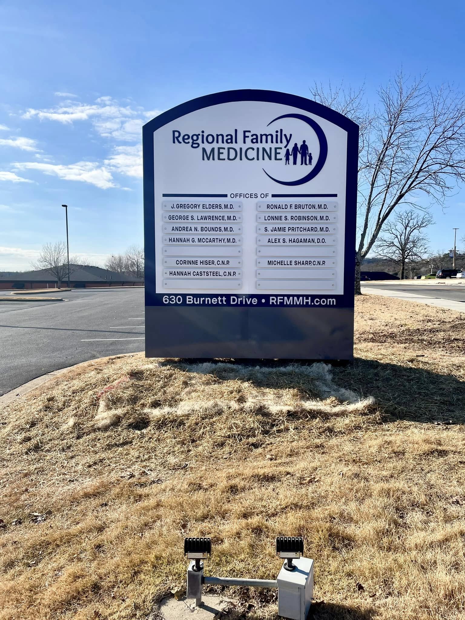 A large monument sign for Regional Family Medicine listing doctors' names and contact information.