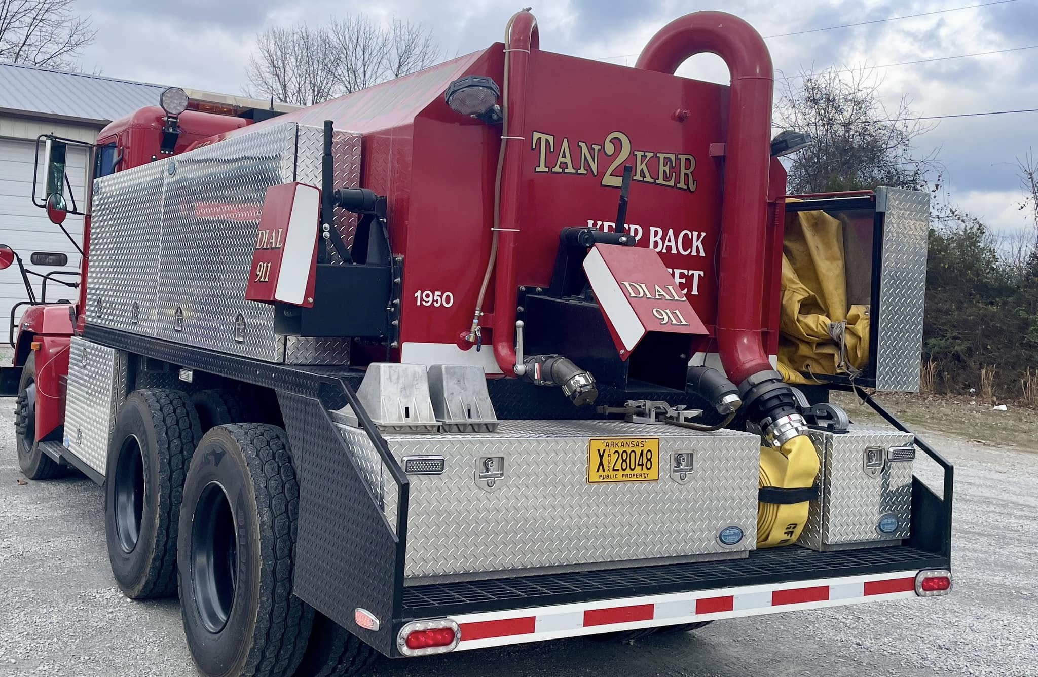 Red tank truck with gold 'TAN2KER' and white 'DIAL 911' vinyl lettering