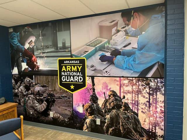 Large custom wall graphic mural for Arkansas Army National Guard featuring various service photos