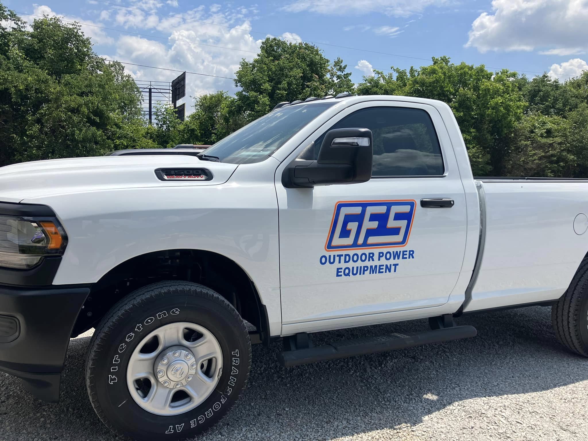 White Ram truck with door decals for GFS Outdoor Power Equipment company