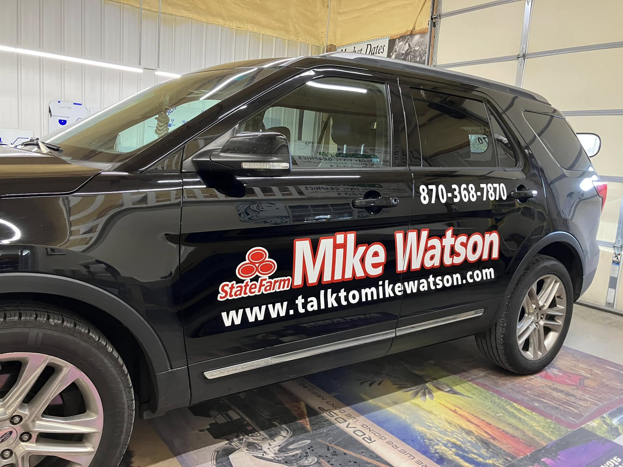 Black SUV with vinyl lettering and logo for State Farm agent Mike Watson