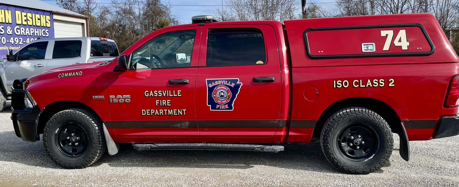 Red Ram 1500 truck with "Gassville Fire Department" lettering and logo, and "ISO Class 2" lettering on the back.