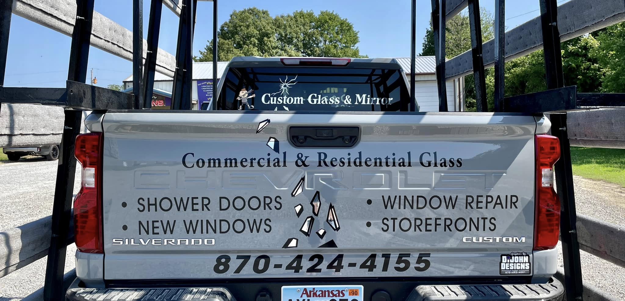 Gray Silverado pickup truck with custom vinyl graphics on the tailgate for a glass and mirror company