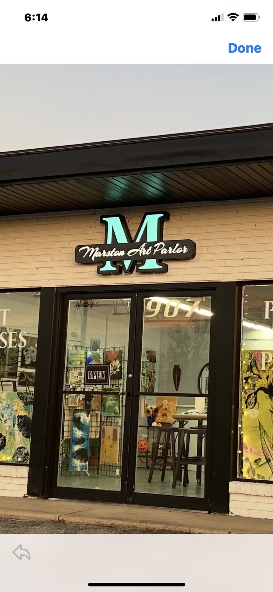 Custom-lit channel letter and dimensional sign for Marston Art Parlor, glowing blue-green