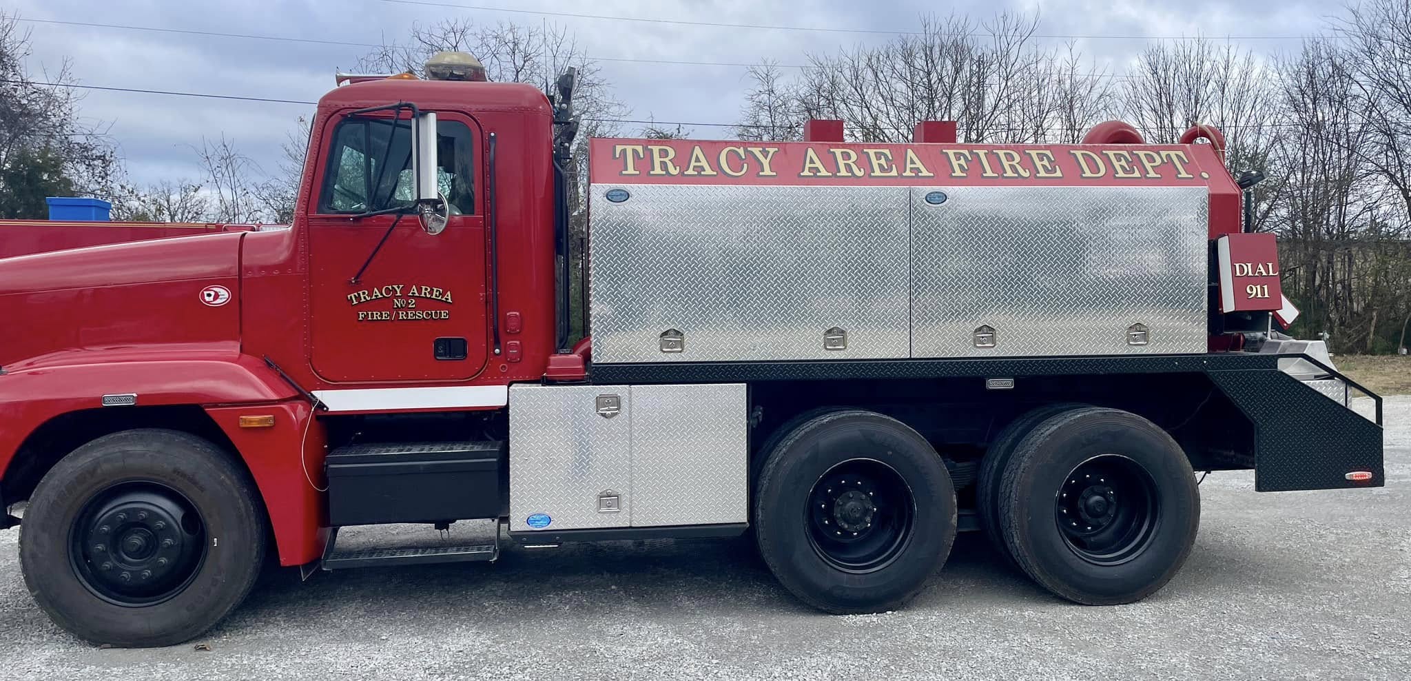 Red fire/rescue truck with gold vinyl lettering for Tracy Area Fire Dept.