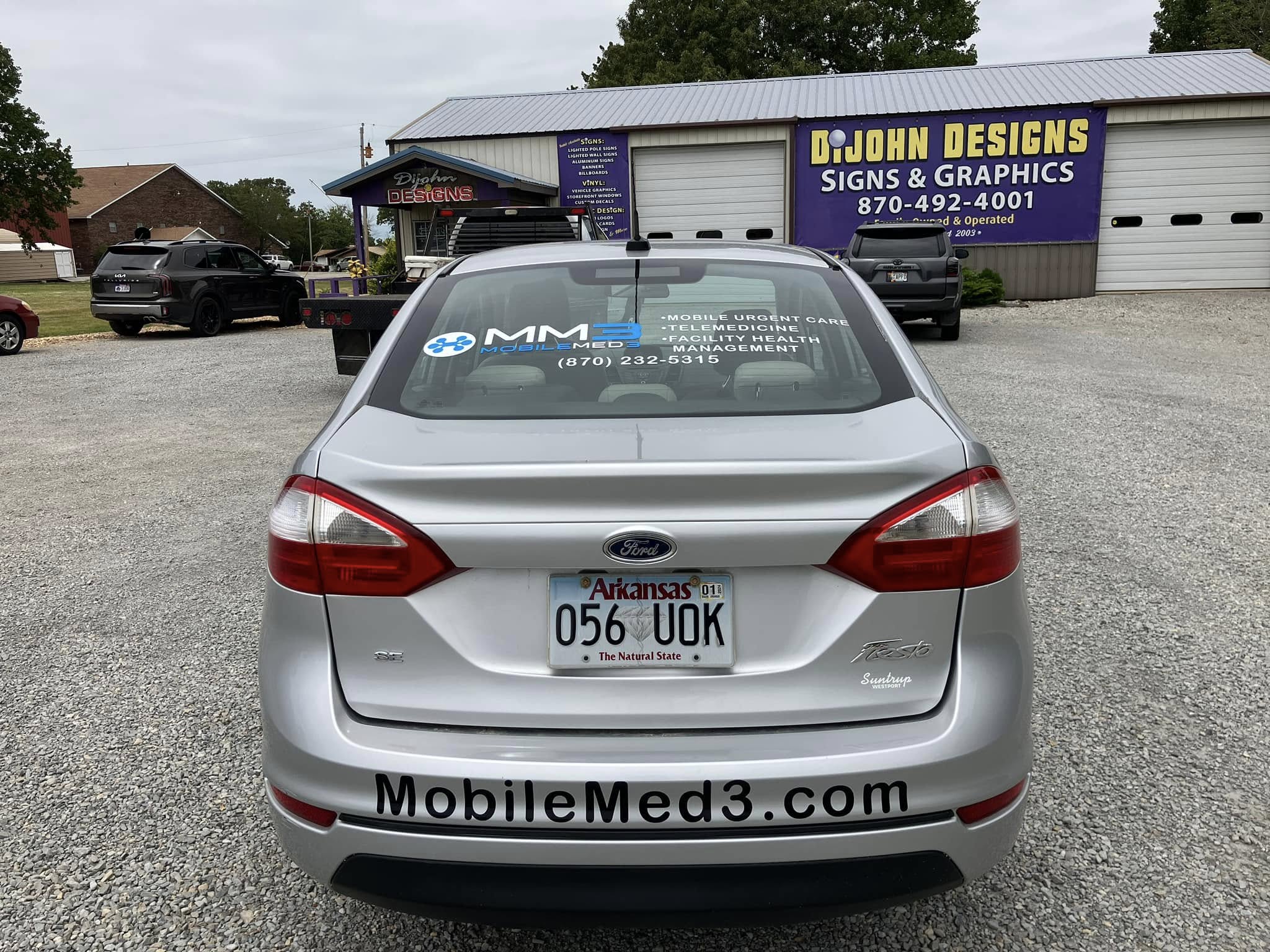 Custom vinyl decals and window graphics for Mobile Med3 on a silver Ford Fiesta.
