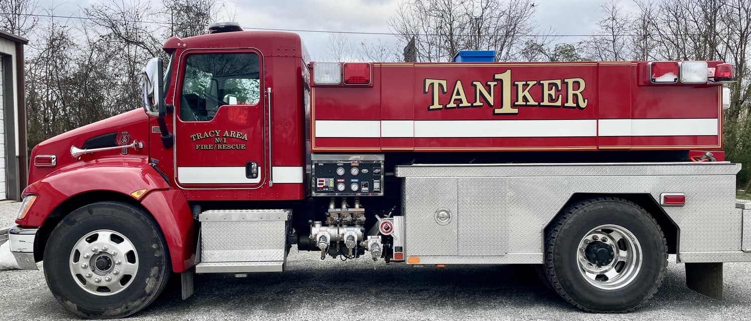 Red fire truck with gold and white vinyl graphics for Tracy Area Fire/Rescue and TAN1KER.